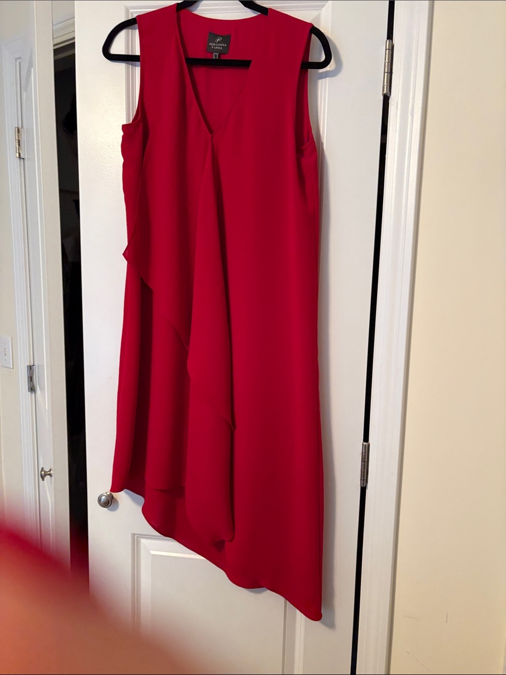 Red sleeveless dress with asymmetrical hem